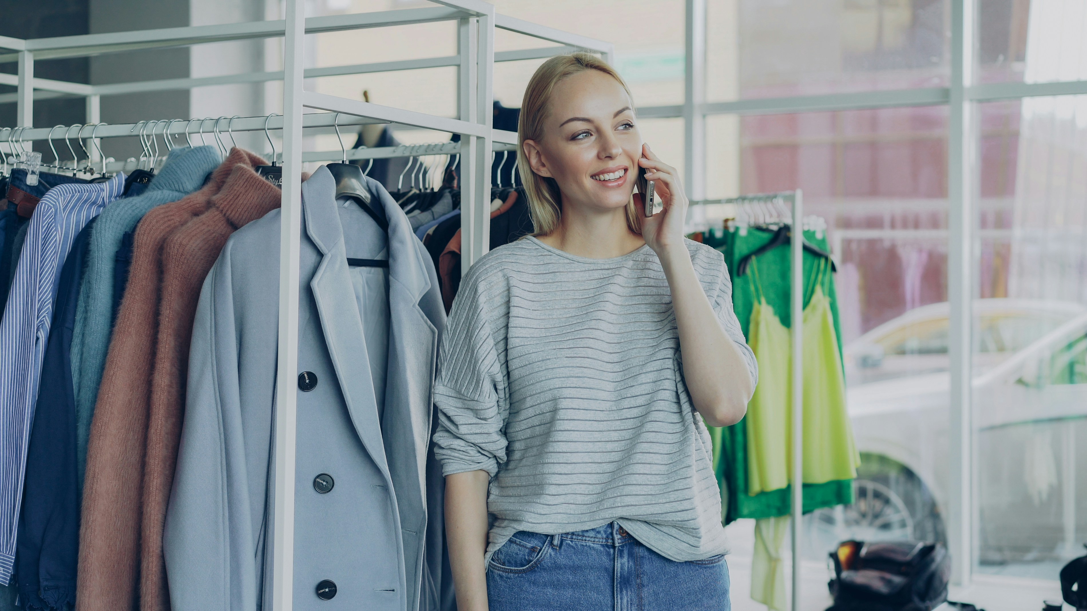 Person using a smartphone to chat, representing frictionless AI-first fashion discovery
